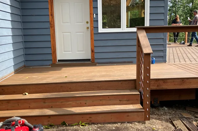 Detail of Grill 724 sq ft Trex deck with cable rails